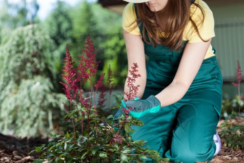 Gardeners wearing protective equipment while working